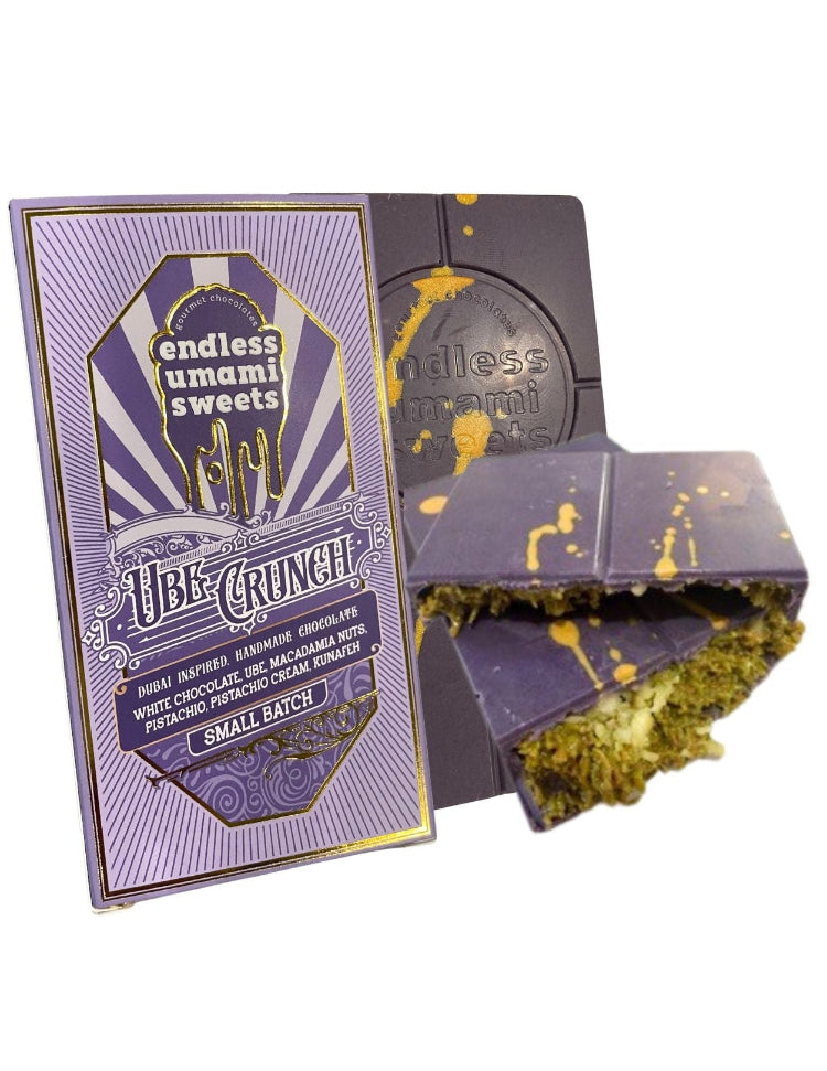Ube Crunch chocolate bar with packaging and a broken piece showing the pistachio filling by Endless Umami Sweets.